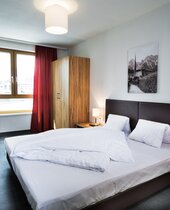 Schlafzimmer in der Residence Schillerstraße Zell am See